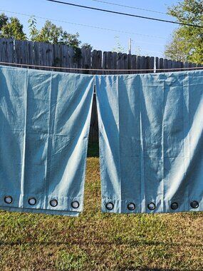 Pair of light aqua curtains with backing  37" x 83"